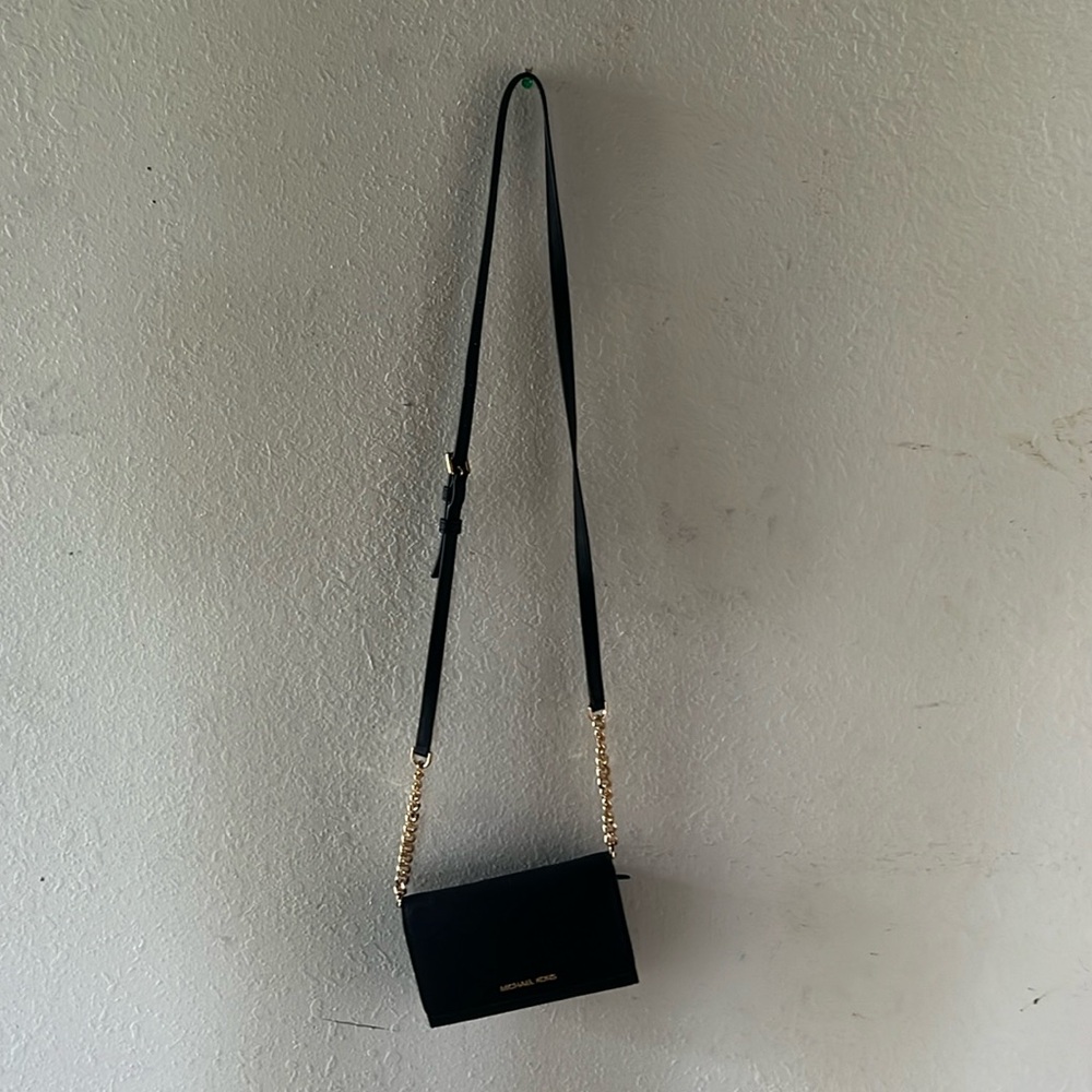 Michael Kors wallet/purse.  Black with gold chain. Used once.